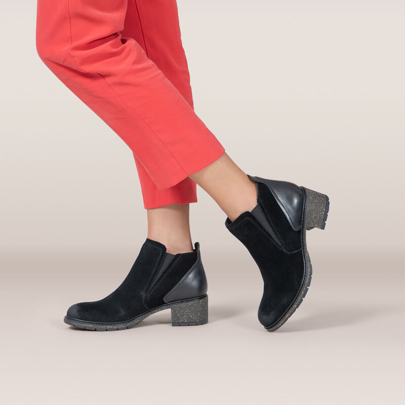 black slip-on boot on feet 